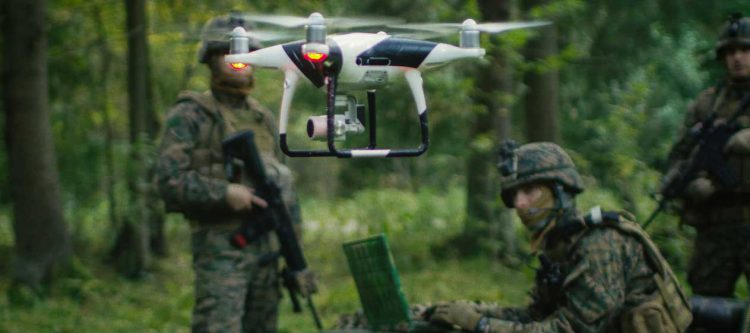 Defense operators with UAV in forest