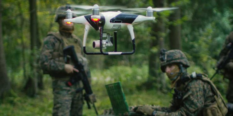 Defense operators with UAV in forest