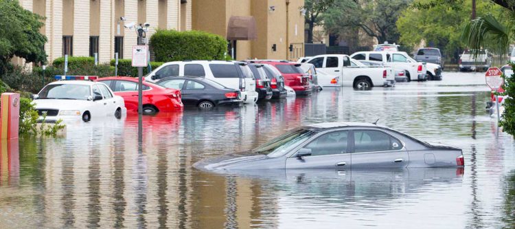 Submerged car in flooded street