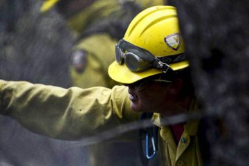 Wildland firefighter wearing a helmet